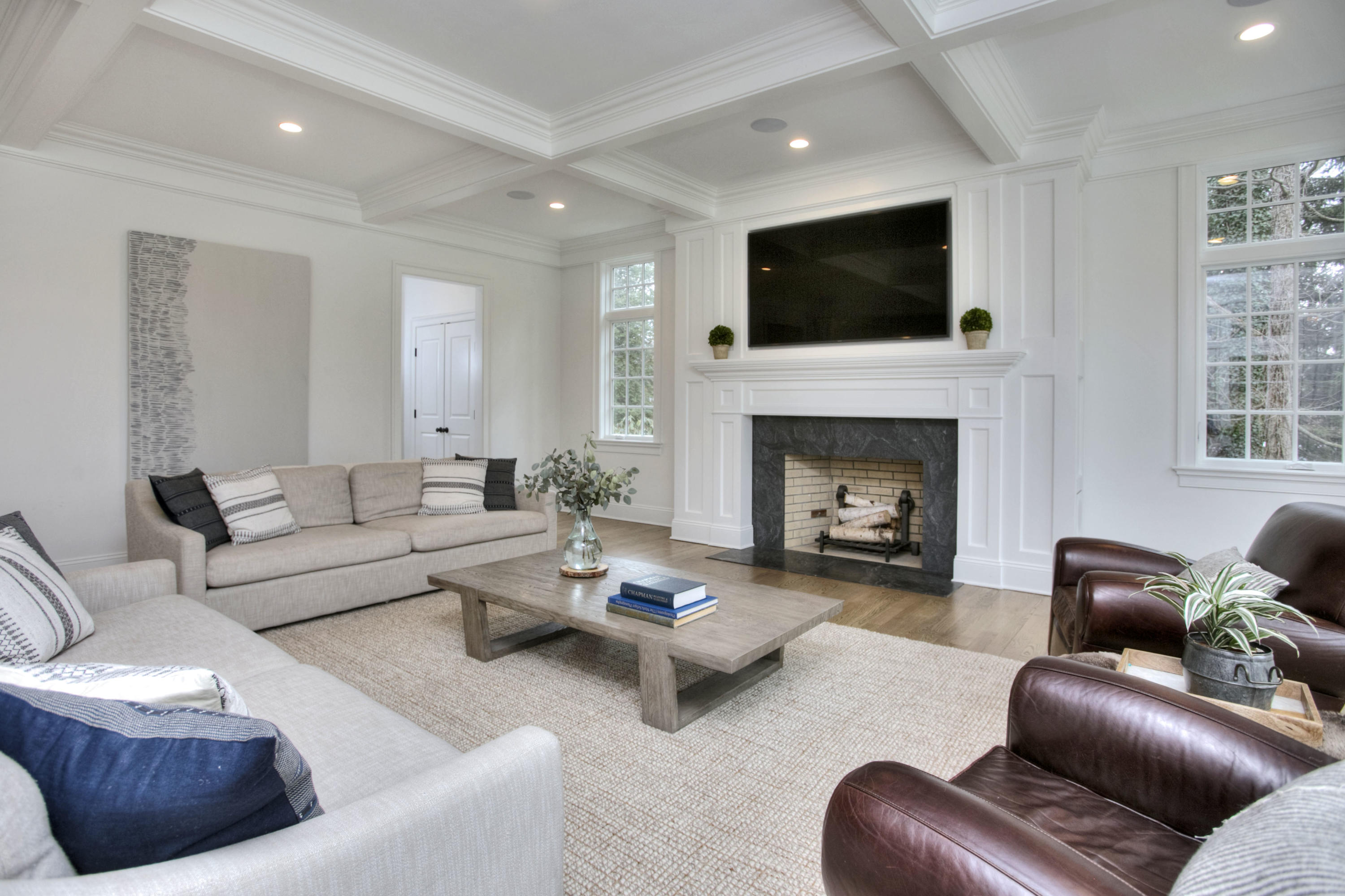 61 Stony Brook Road Darien, CT 06820 - Photo 15 of 43 a living room with furniture a fireplace and a flat screen tv