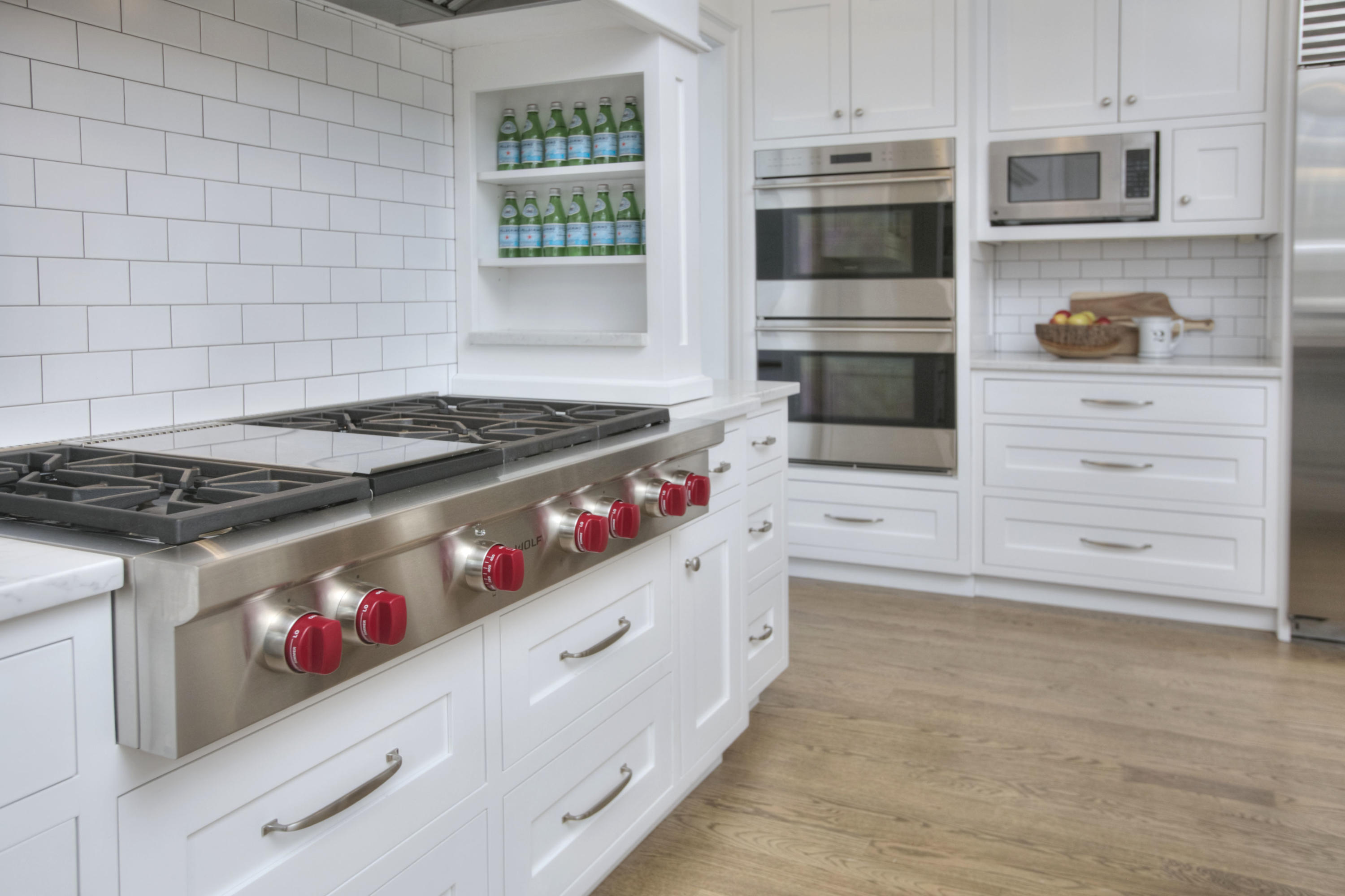 61 Stony Brook Road Darien, CT 06820 - Photo 23 of 43 a kitchen with white cabinets and appliances