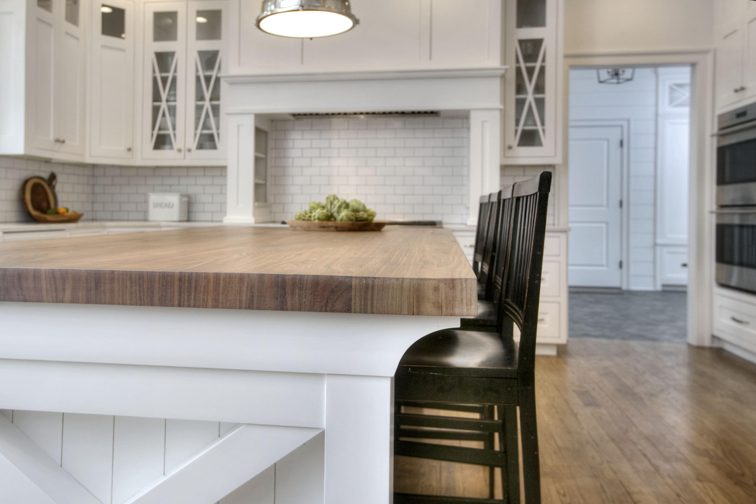 61 Stony Brook Road Darien, CT 06820 - Photo 25 of 43 a kitchen with a wooden floor and a refrigerator