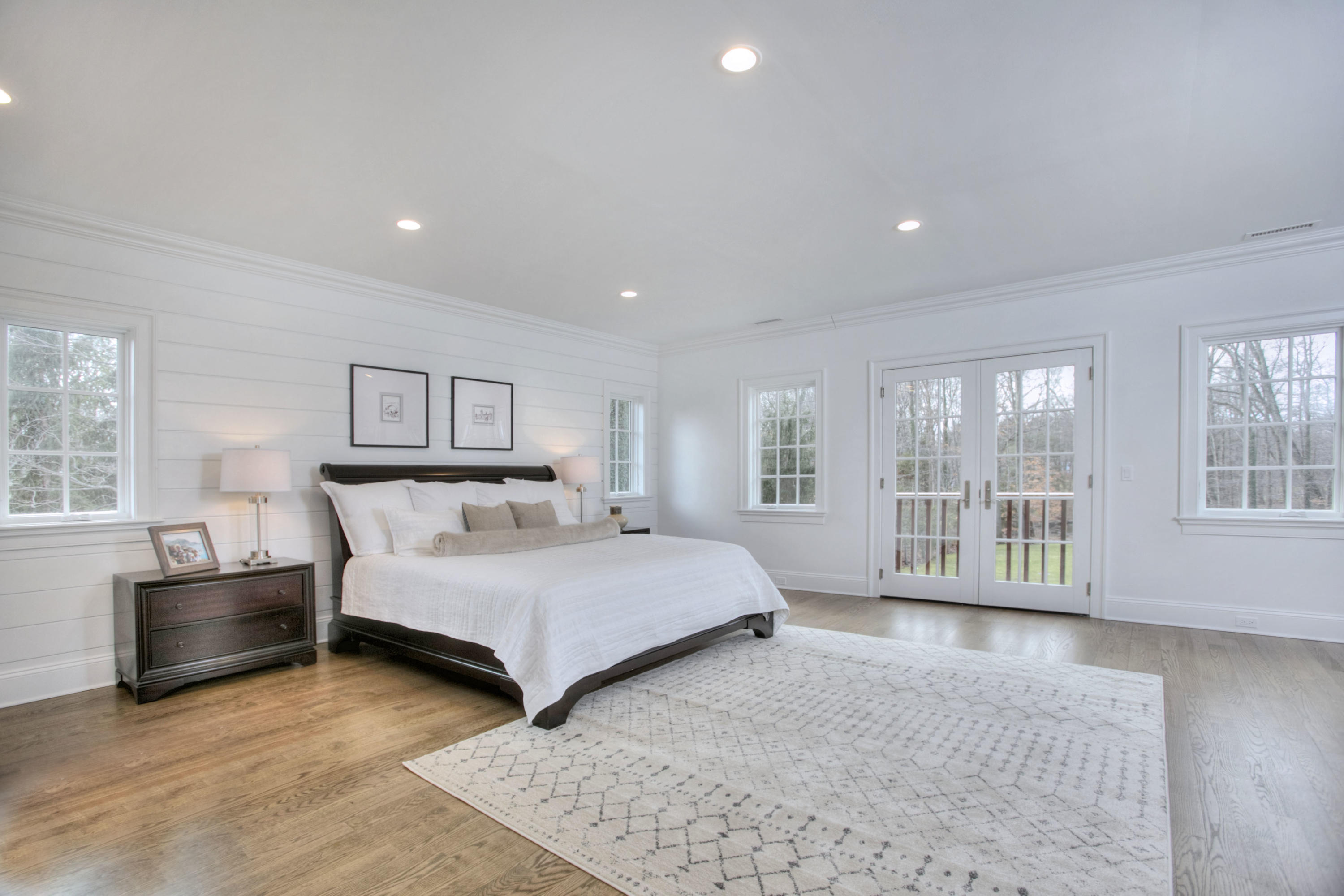 61 Stony Brook Road Darien, CT 06820 - Photo 28 of 43 a spacious bedroom with a bed and large window