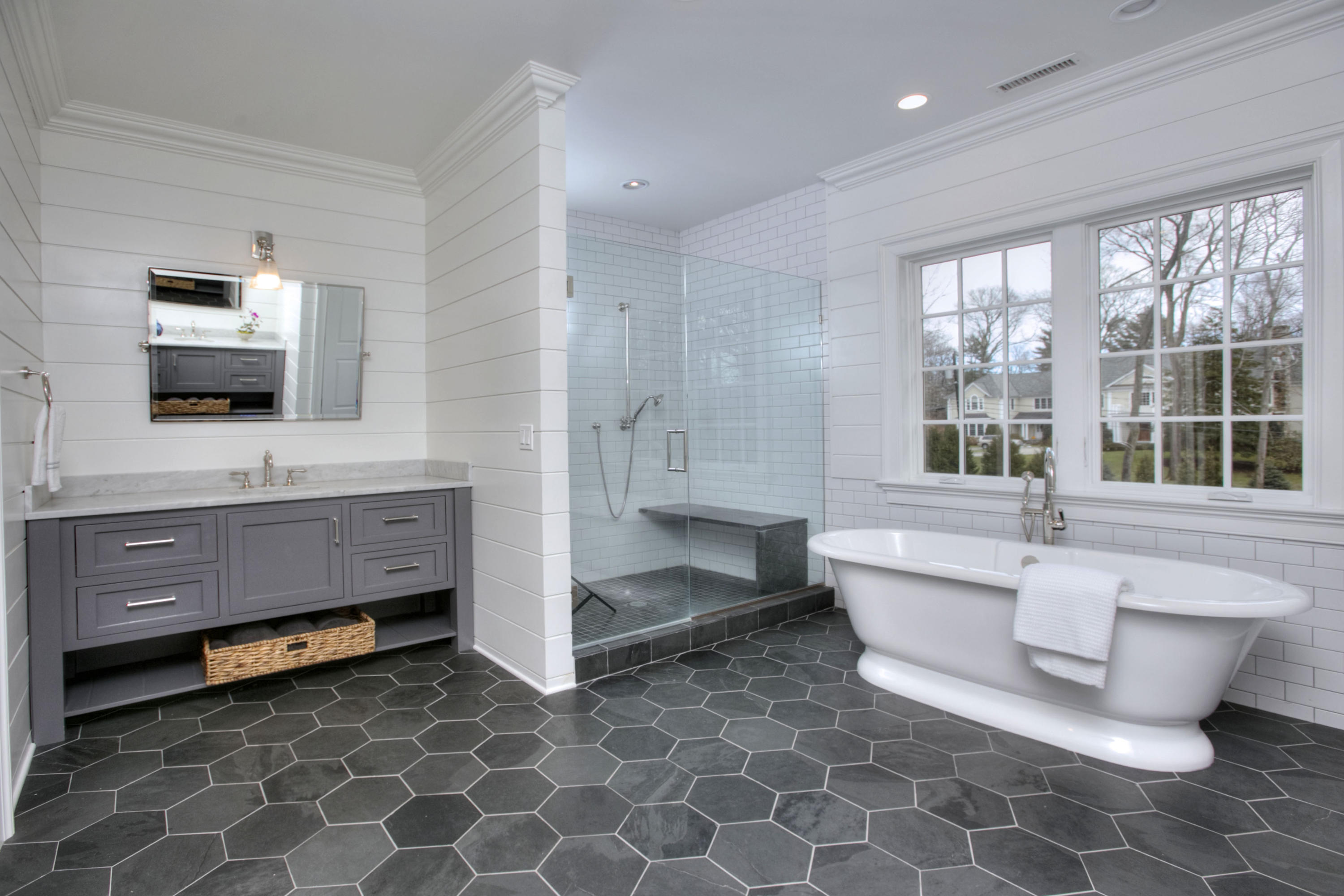 61 Stony Brook Road Darien, CT 06820 - Photo 30 of 43 a bathroom with a bathtub sink and mirror