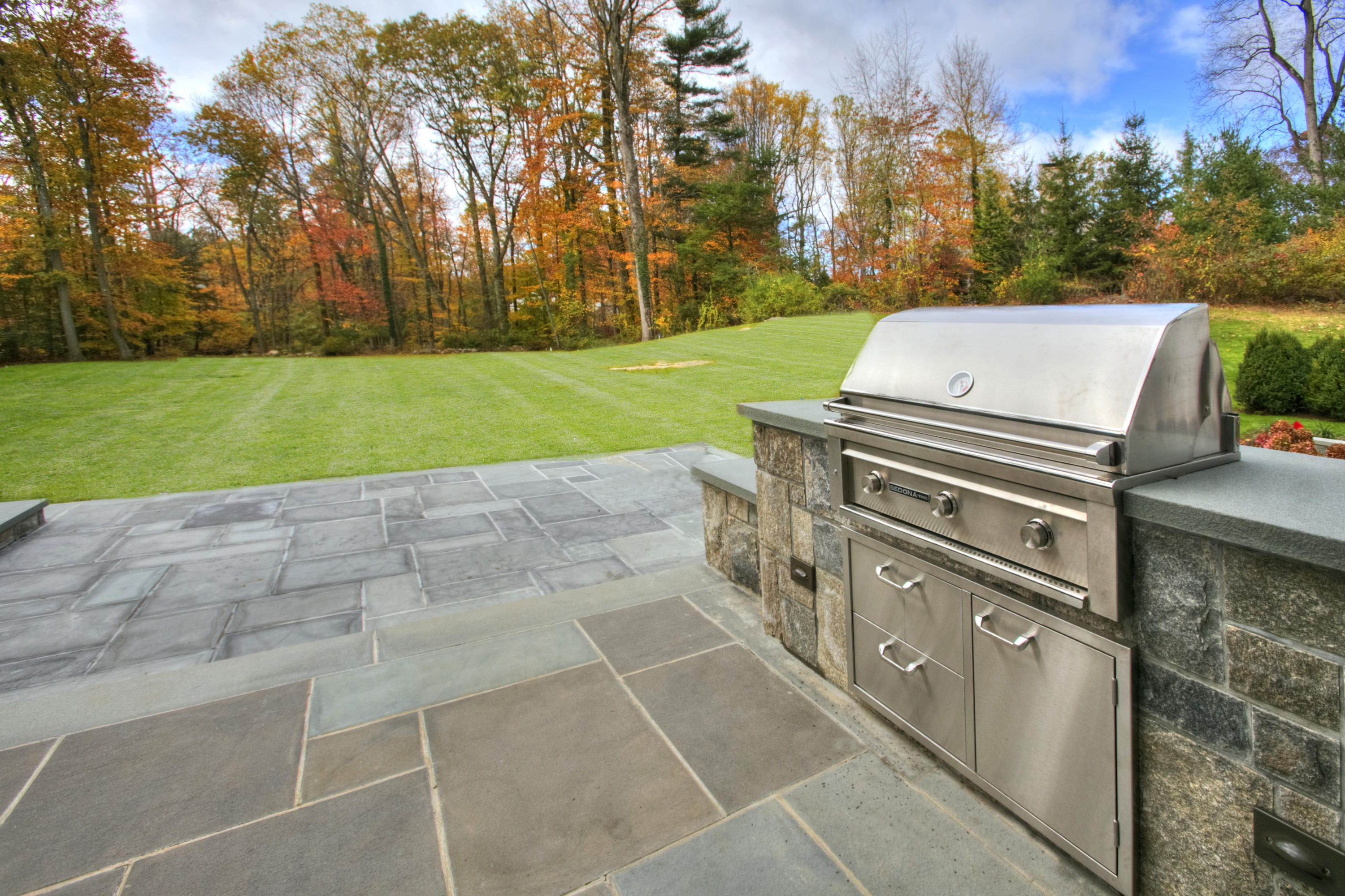 61 Stony Brook Road Darien, CT 06820 - Photo 4 of 43 a view of a yard with outdoor kitchen