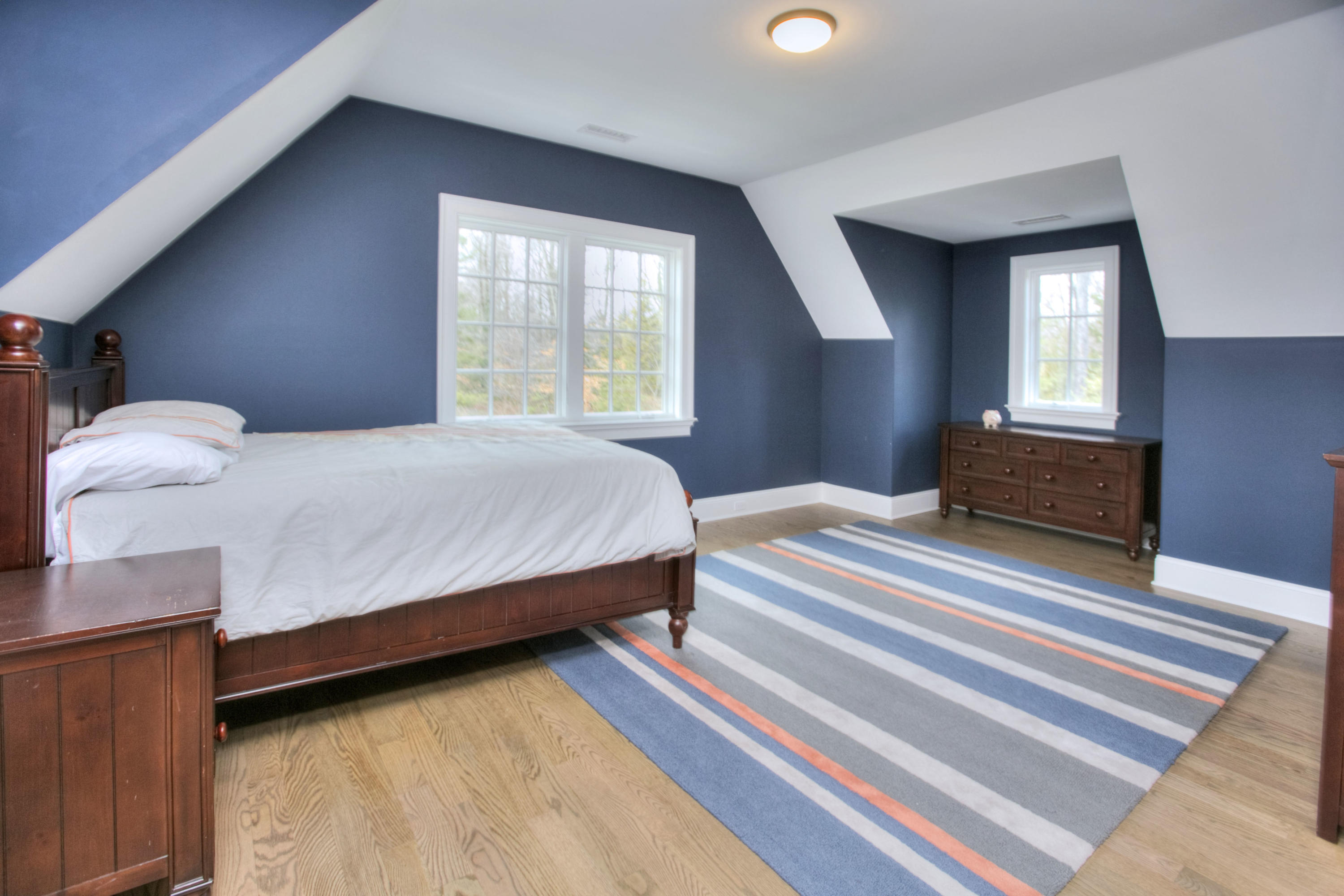 61 Stony Brook Road Darien, CT 06820 - Photo 34 of 43 a bedroom with a bed and window