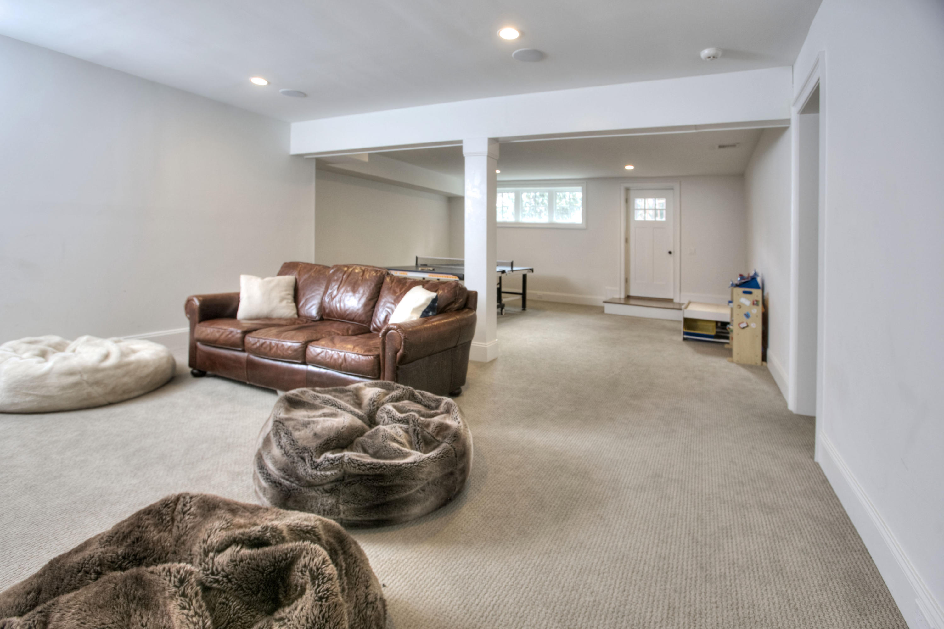 61 Stony Brook Road Darien, CT 06820 - Photo 40 of 43 a living room with furniture and a large window