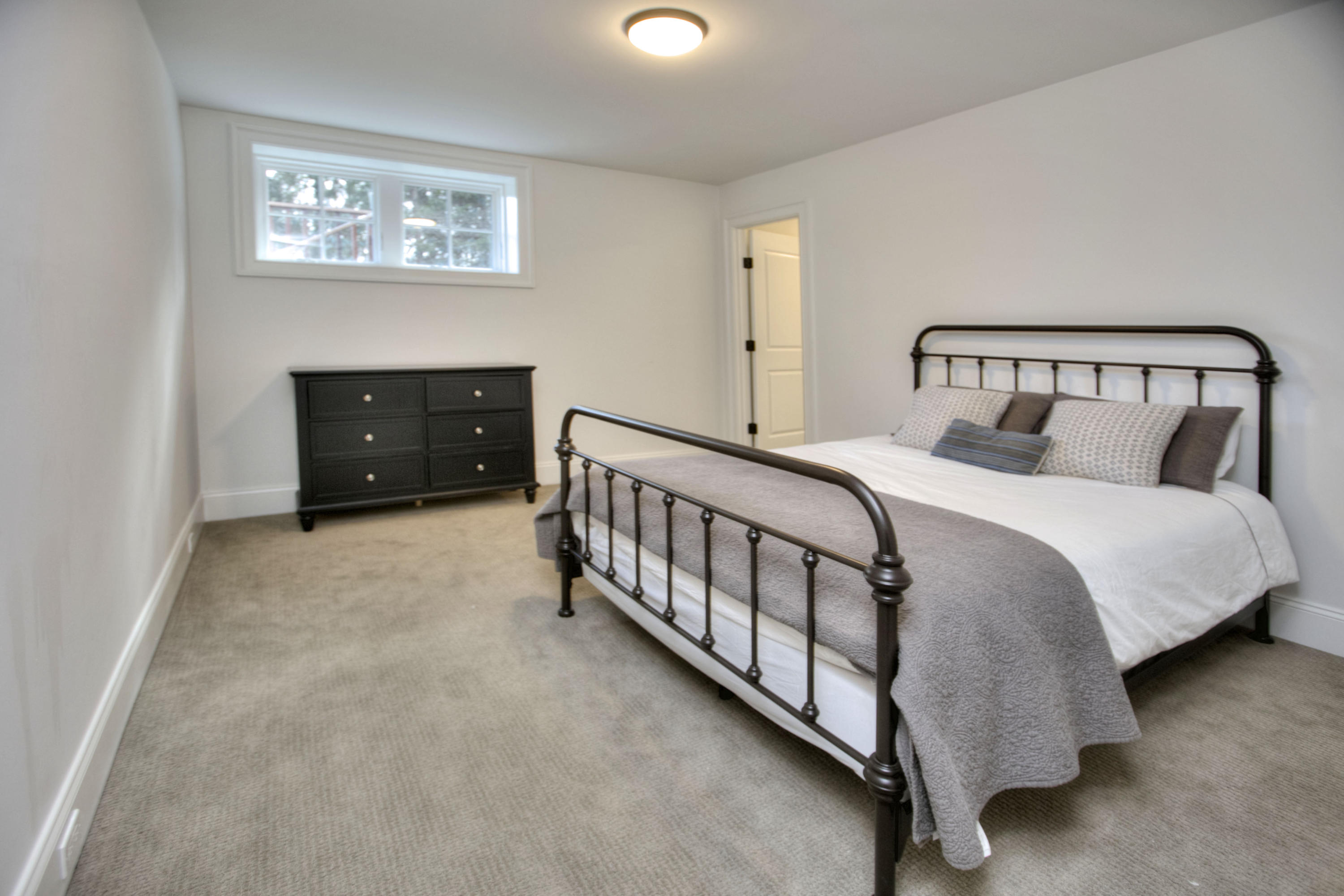 61 Stony Brook Road Darien, CT 06820 - Photo 42 of 43 a bedroom with a bed and a lamp on dresser