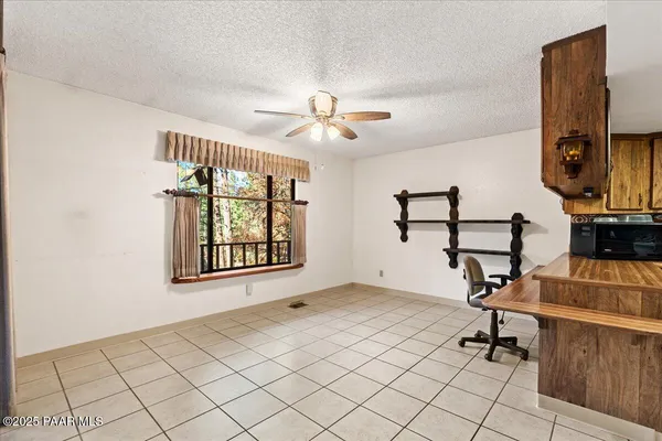 a kitchen with a stove sink and cabinets