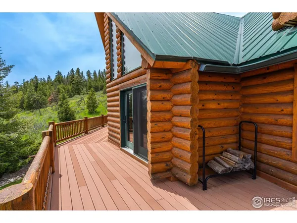 a view of balcony with wooden floor and outdoor seating