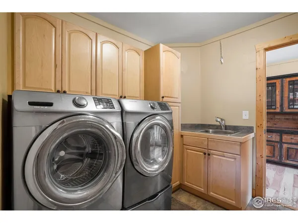 a utility room with closet dryer and washer