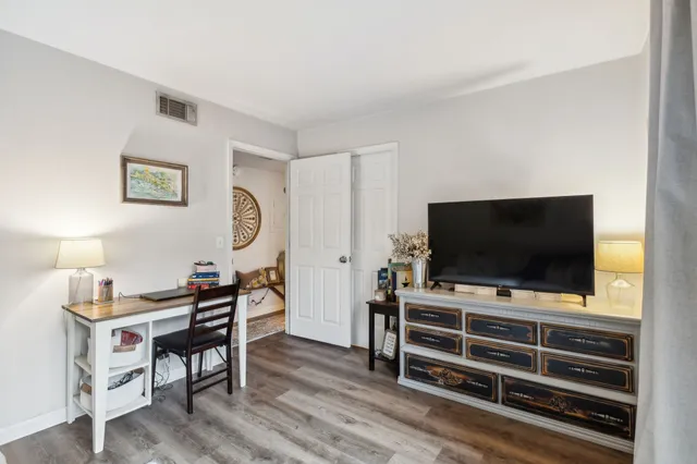 a room with furniture and flat screen tv