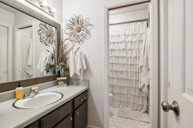a bathroom with a sink double vanity and a mirror