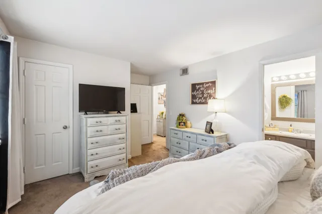a bedroom with a bed and closet