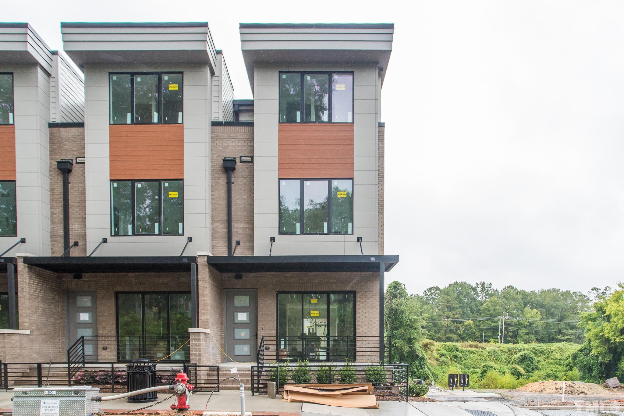 719 Willard Street Durham, NC 27701 - Photo 1 of 24 a view of a building with a window and brick walls