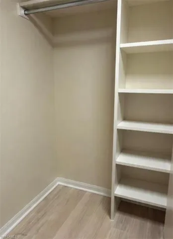 a view of an empty walk in closet