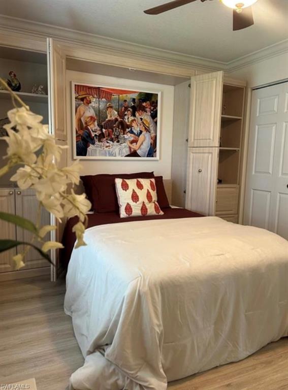 121 Ginger Road Venice, FL 34293 - Photo 15 of 34 a bedroom with a bed and painting on the wall