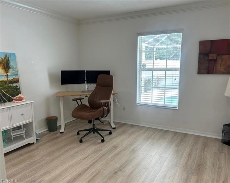 121 Ginger Road Venice, FL 34293 - Photo 17 of 34 a view of a workspace with furniture and a window