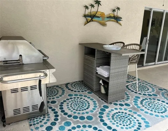 a kitchen with a sink a stove and cabinets