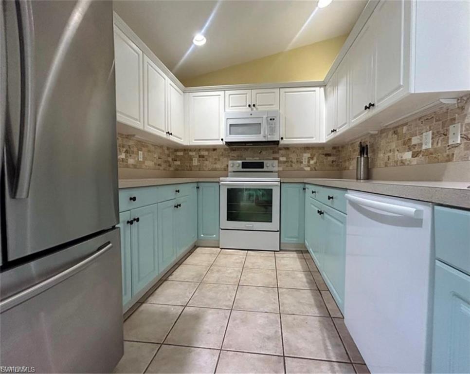 121 Ginger Road Venice, FL 34293 - Photo 8 of 34 a kitchen with stainless steel appliances granite countertop a sink stove and cabinets