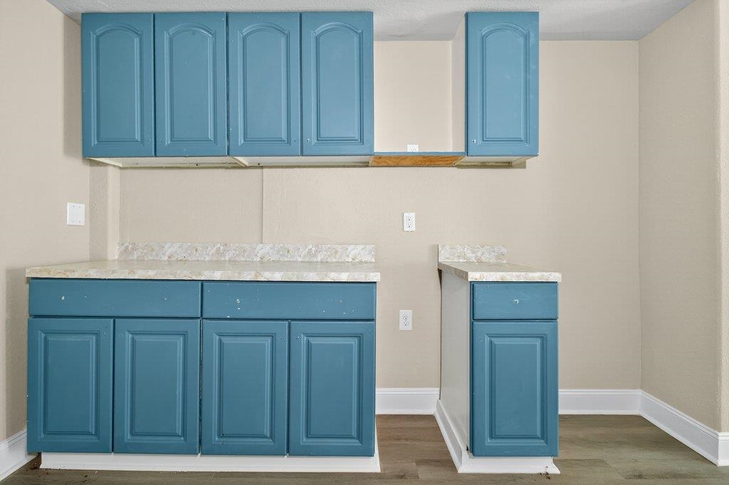 125 Menendez Road St. Augustine, FL 32080 - Photo 28 of 41 a kitchen with granite countertop wooden cabinets