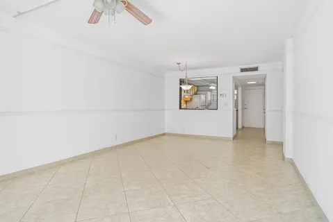 a kitchen with cabinets stainless steel appliances and a counter space