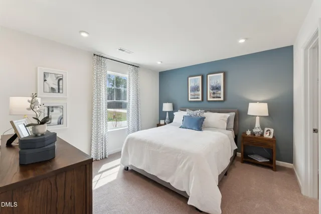 a bedroom with a bed and a couch