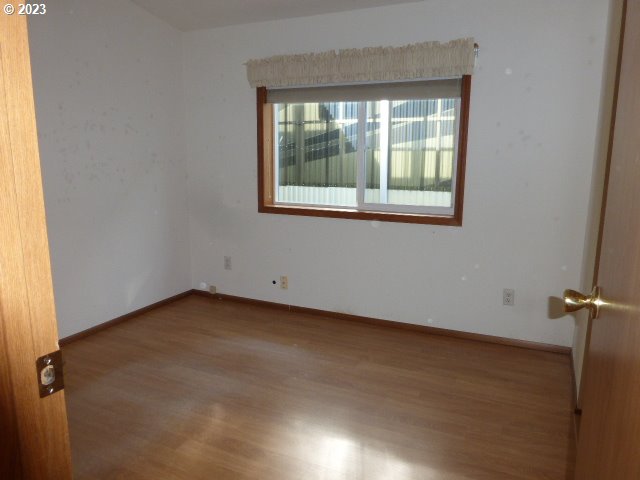 100 River Bend Road, Unit 80 Reedsport, OR 97467 - Photo 16 of 22 an empty room with a window