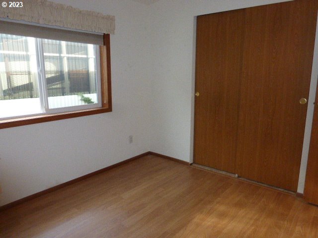 100 River Bend Road, Unit 80 Reedsport, OR 97467 - Photo 17 of 22 an empty room with a window