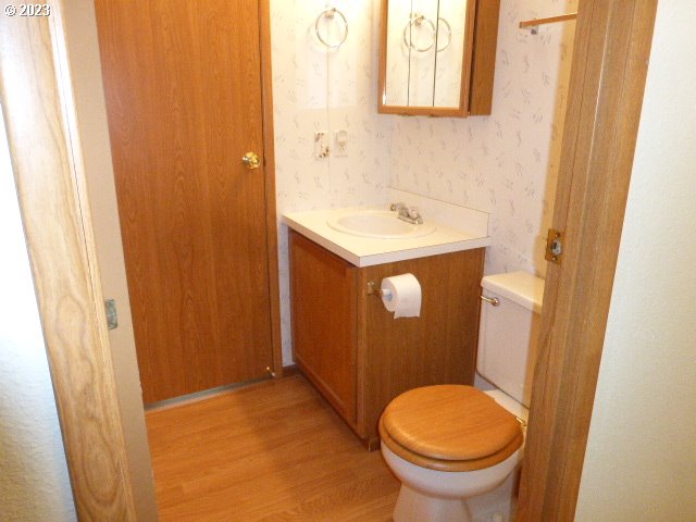100 River Bend Road, Unit 80 Reedsport, OR 97467 - Photo 18 of 22 a bathroom with a sink and a toilet