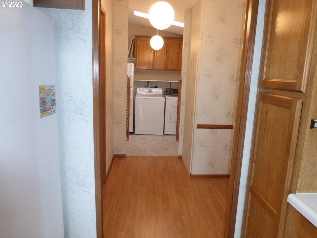 100 River Bend Road, Unit 80 Reedsport, OR 97467 - Photo 20 of 22 a view of a room with wooden floor and cabinet