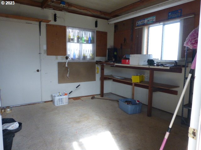 100 River Bend Road, Unit 80 Reedsport, OR 97467 - Photo 22 of 22 a living room with furniture window and wooden floor