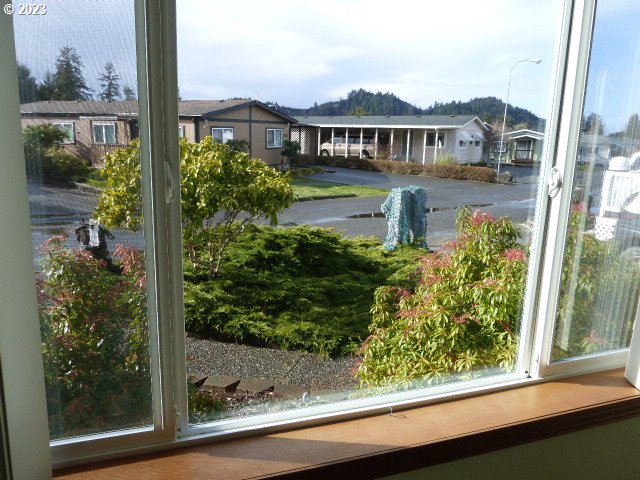 100 River Bend Road, Unit 80 Reedsport, OR 97467 - Photo 10 of 22 a front view of a house with a yard