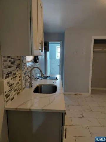 a view of a sink and a microwave