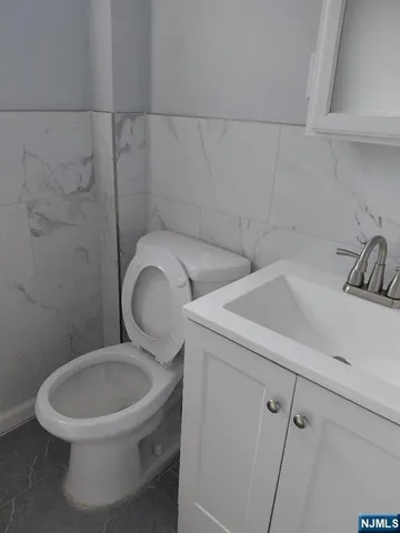 a bathroom with a toilet and a sink