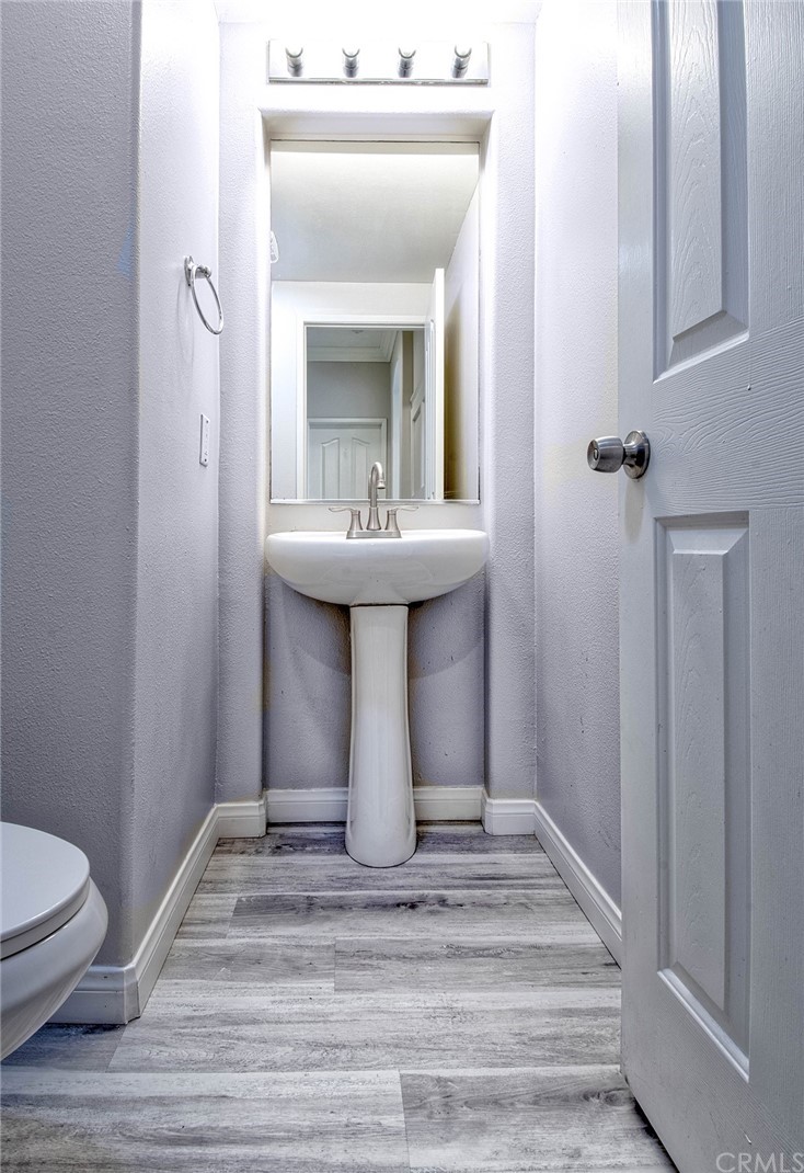 83 Sapphire, Unit 46 Irvine, CA 92602 - Photo 5 of 18 a bathroom with a sink toilet