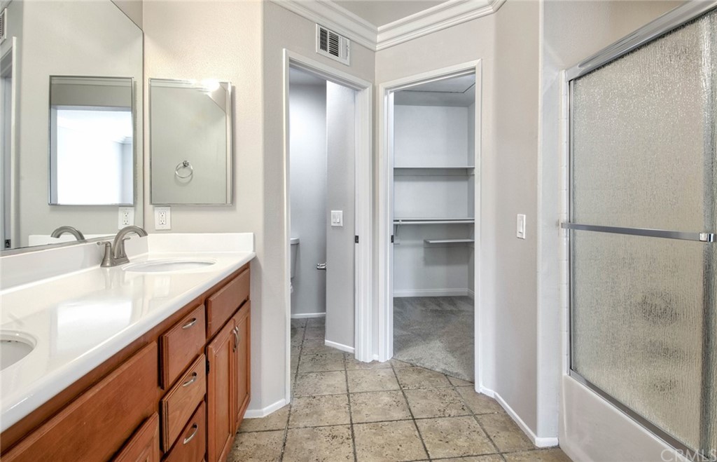 83 Sapphire, Unit 46 Irvine, CA 92602 - Photo 10 of 18 a bathroom with a sink and a mirror