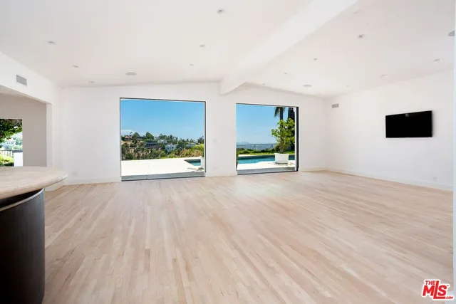 a view of a glass door with a potted plant