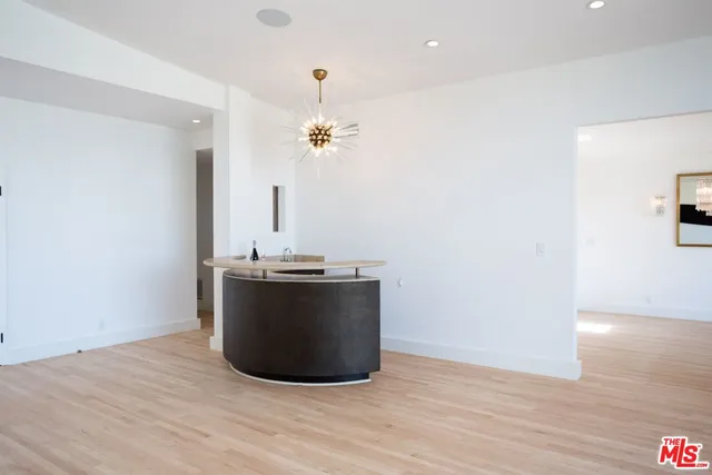 a view of a kitchen with a sink and a window