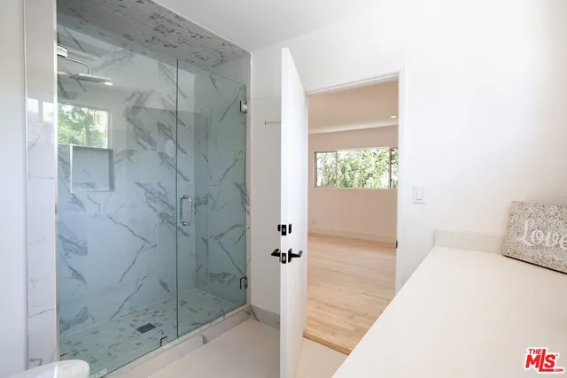 a kitchen with a stove a sink and a refrigerator