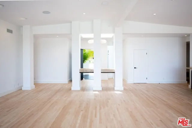 a view of a living hall with wooden floor