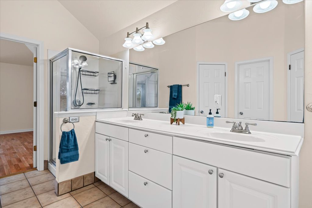 8111 Davis Mountain Pass Austin, TX 78726 - Photo 17 of 37 a bathroom with a double vanity sink mirror and
