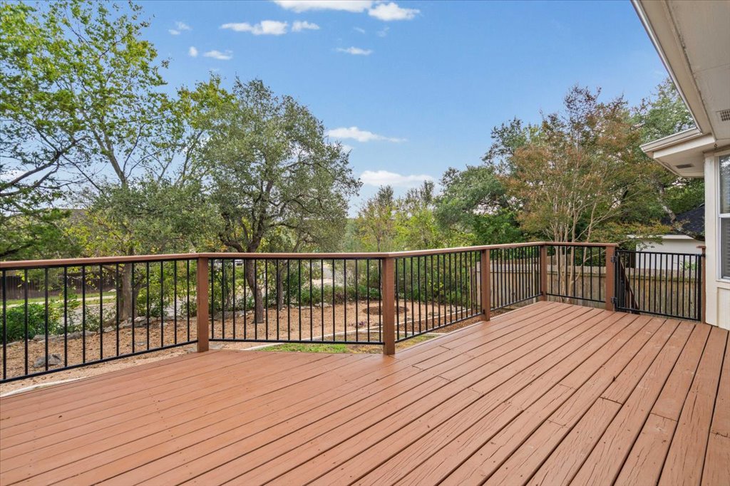 8111 Davis Mountain Pass Austin, TX 78726 - Photo 23 of 37 a balcony with wooden floor and fence