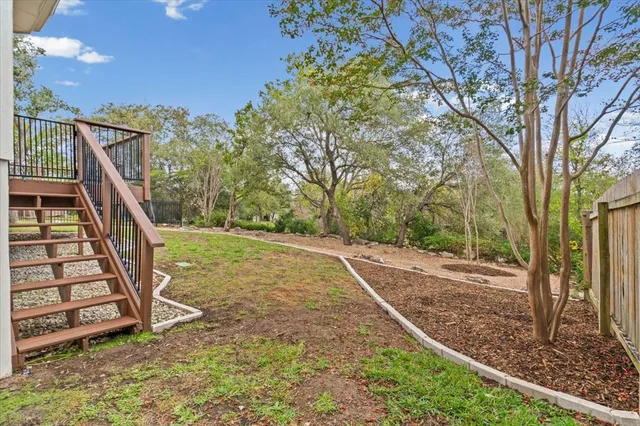 a view of a yard with a tree