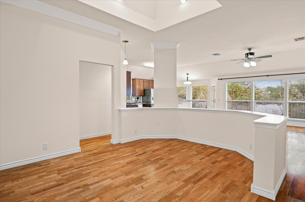 8111 Davis Mountain Pass Austin, TX 78726 - Photo 32 of 37 a view of a kitchen with wooden floor and a window