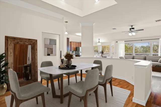 a dining room with furniture and window