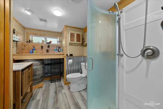 a bathroom with a sink a mirror and a toilet