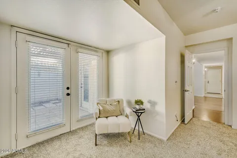 a view of room with furniture and wooden floor