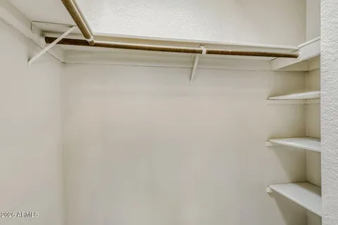 a view of a room with shelf on the wall