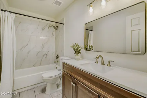 a bathroom with a sink a toilet and a bathtub