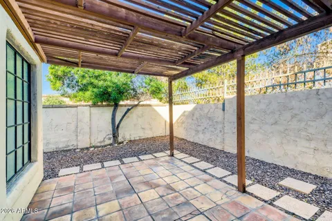 a view of a porch with a floor to ceiling windows and yard