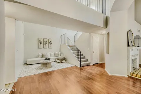 a view of a livingroom with furniture and staircase