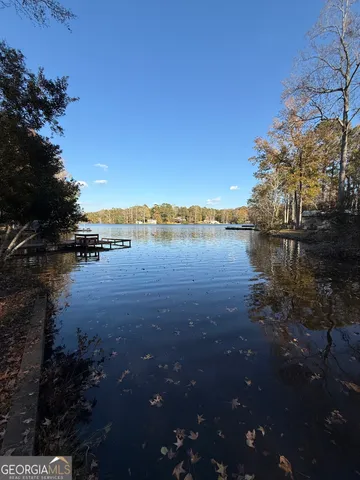 a view of kitchen with kitchen island and stainless steel appliances